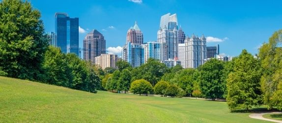 the atlanta city skyline seen from piedmont park